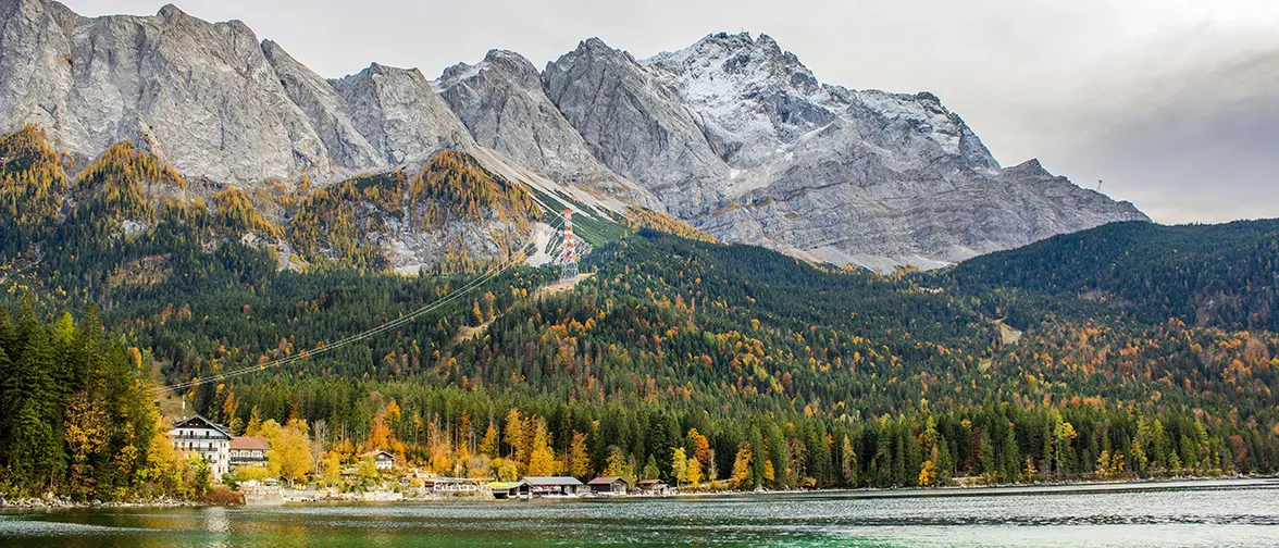 Image: Zoreslava Marchuk (M.A. Architecture / TUM)<br />
"The photo was taken in the fall of 2023 and shows the Zugspitze, the highest mountain in Germany, as well as one of the country's most beautiful natural wonders - the Eibsee. The Zugspitze is, in my opinion, one of the most important unofficial symbols of Germany that anyone who starts to learn the German language and culture gets to know. It is also a very important place for Bavaria. When the weather is nice, it's even possible to see the mountain from the terrace on TUM's main campus."